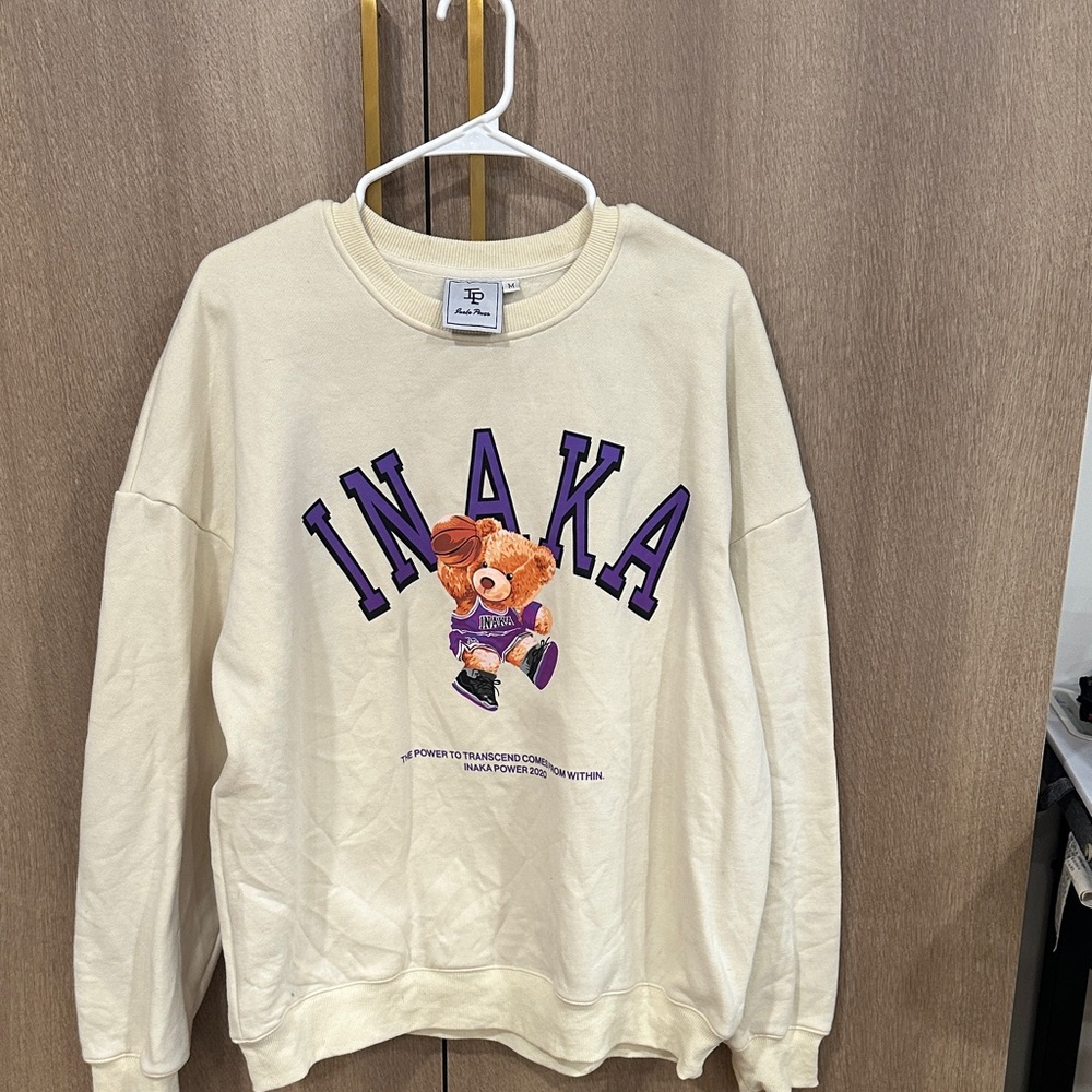 Inaka Power Cream Sweatshirt with Purple Bear Design